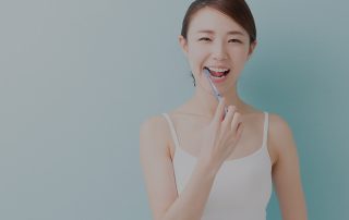 A happy girl, smilling with brushing her white healthy teeth.