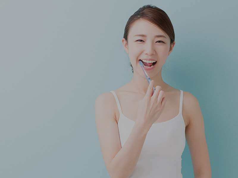 A happy girl, smilling with brushing her white healthy teeth.